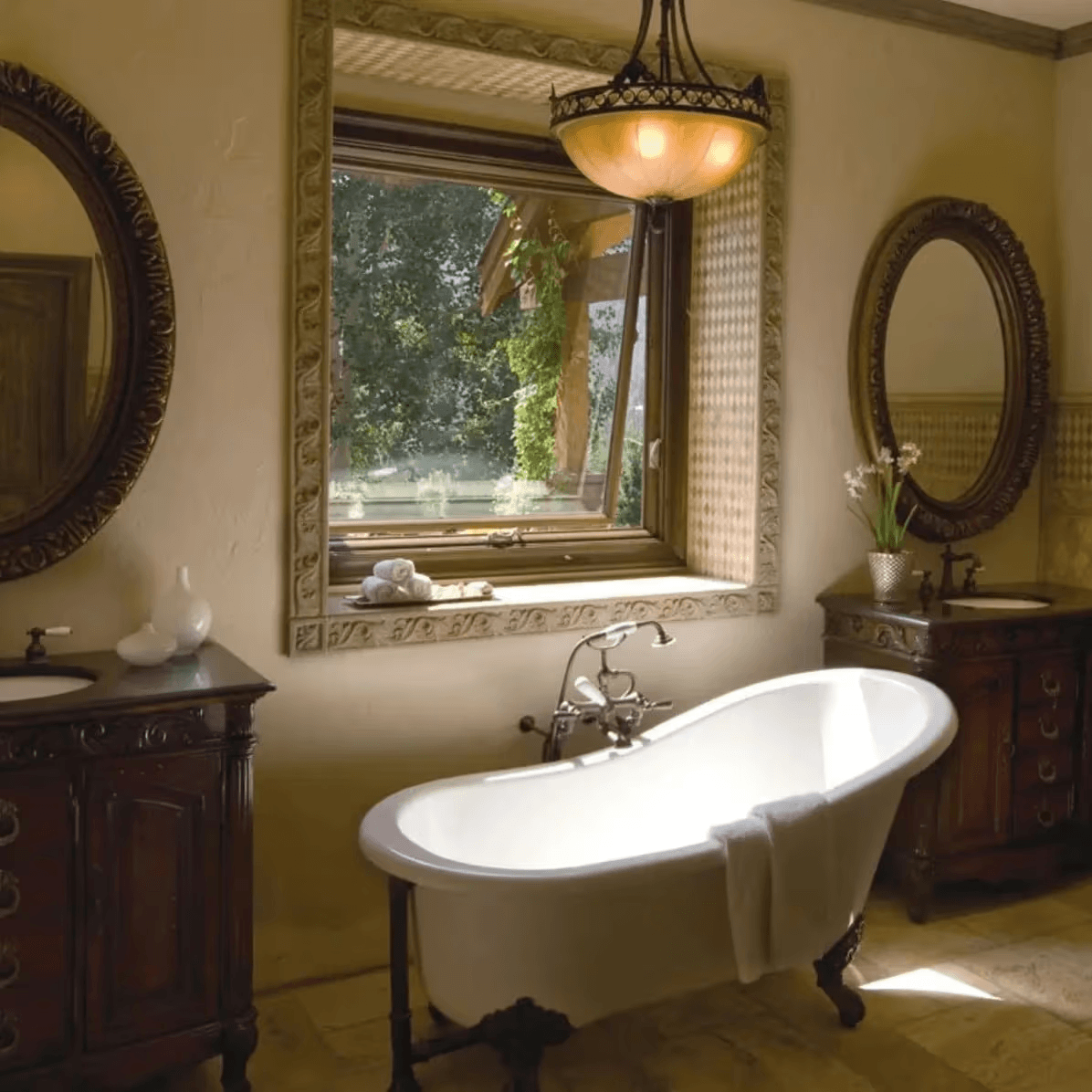 Awning window above a clawfoot bathtub in an ornate bathroom